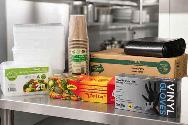 Cartons of takeaway containers, paper cups, cling wrap, gloves and bin liners on a Melbourne restaurant back-of-house shelf
