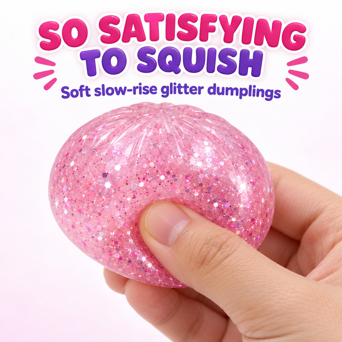 Hand squeezing a pink glitter dumpling squishy showing the soft slow-rise squish