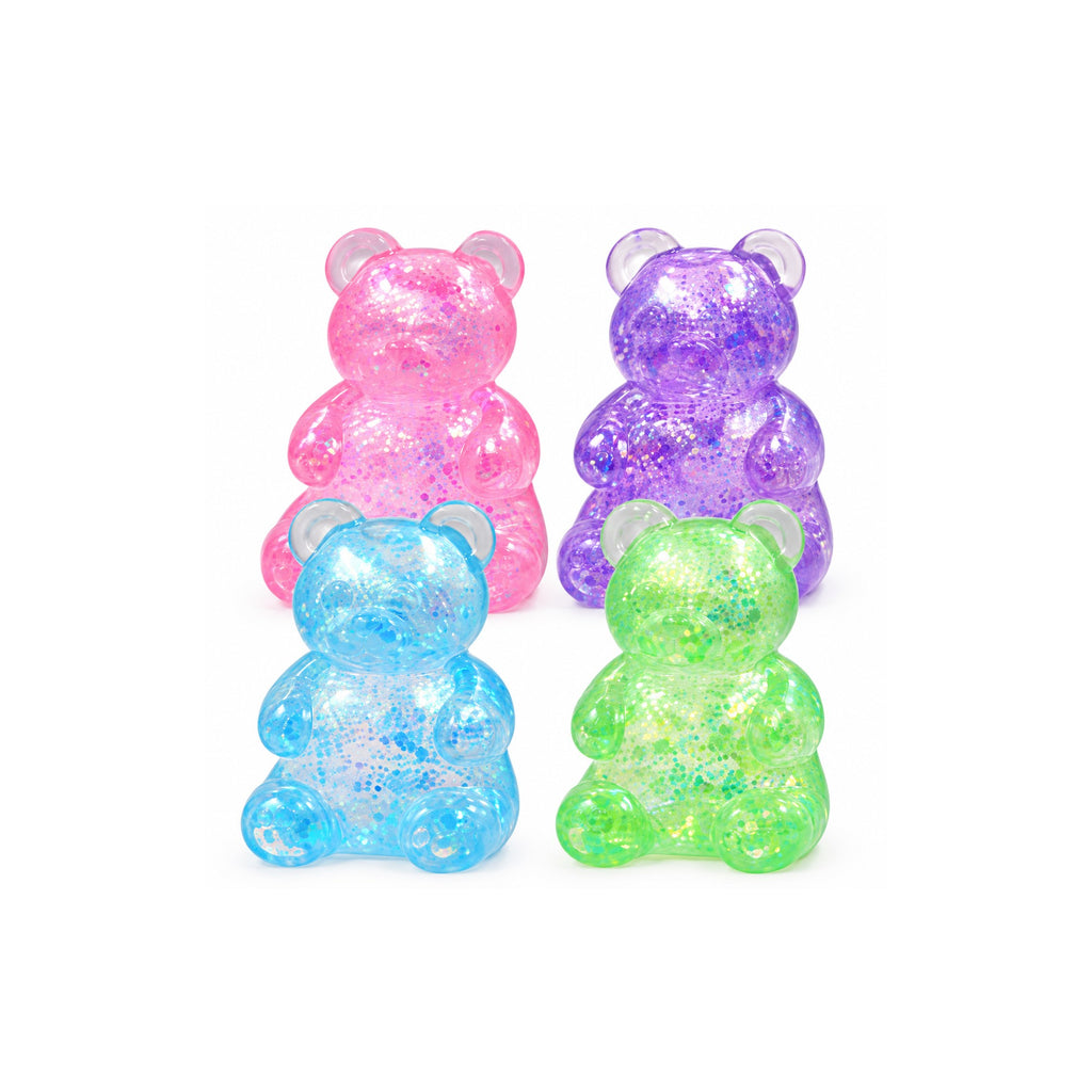 Glitter gummy bear squishy toy in assorted pink, purple, blue and green on a white background