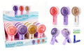 Battery operated 13cm handheld fan with caged grille and fold-out desk stand in pastel colours, batteries included