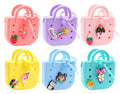 Six silicone coin pouches shaped like mini backpacks with zip and charms in pink, purple, yellow, blue and teal