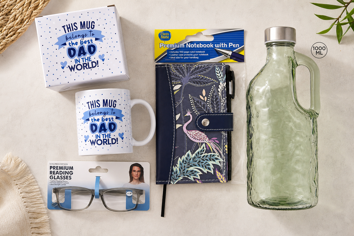 A spread of school Father's Day stall gifts - a boxed mug, coasters, reading glasses and a water bottle