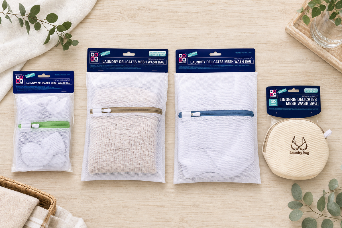 Range of zip mesh laundry bags in small, medium and extra-large sizes laid out flat